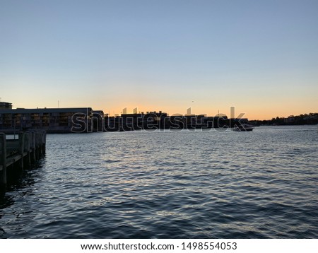 Sydney NSW Australia Darling harbour at Sunset with boats in the harbour and blue waters make it for a nice picture 