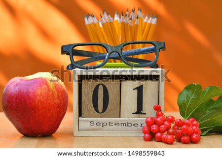 school equipment pencils books glass desk.back to school concept .September 1 text on wooden block calendar