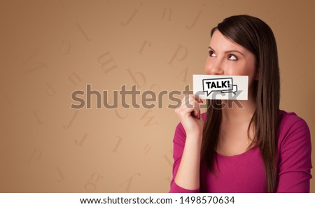 Person holding card in front of his mouth, friendship concept