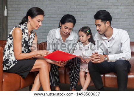 Asian Parent talking with teacher about Plan education for children. Young family and children discuss or advice with professional family psychologist in office Royalty-Free Stock Photo #1498580657