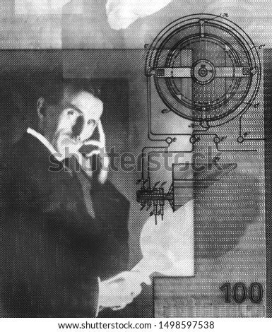 Nikola Tesla portrait on Serbia 100 dinars banknote close-up. Black and white image Royalty-Free Stock Photo #1498597538