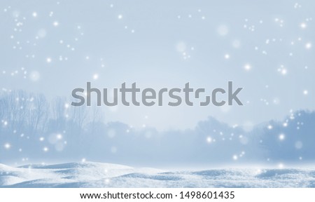 beautiful white empty winter idyll, shiny snowflakes on blurred winter landscape, christmas background with advertising space on snow cover, holiday season backdrop