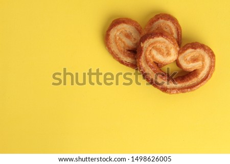 Puff pastry cookies on colorful background