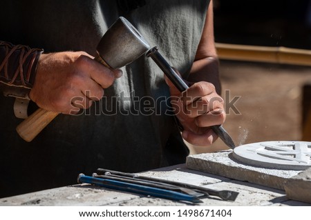 Chisel for sculpting stone, artistic work Royalty-Free Stock Photo #1498671404