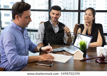 business partners sign two contracts at group meeting, businessman Royalty-Free Stock Photo #1498702190