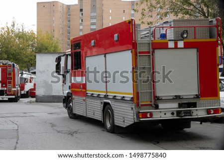 A line of fire engines.  Fire in the room.  Fire hazard.  Failure to comply with fire safety regulations