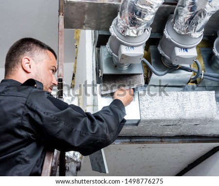 Ventilation cleaning. Specialist at work. Repair ventilation system (HVAC). Industrial background Royalty-Free Stock Photo #1498776275