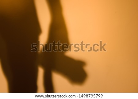 Shadow of the photographer on the wall