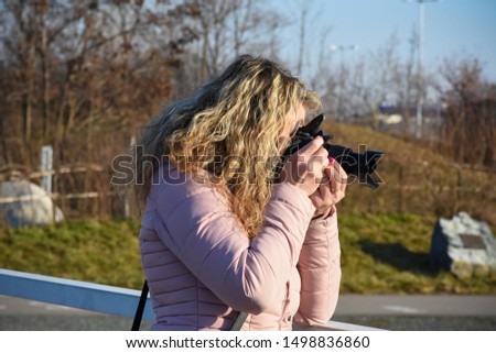 female photographer is taking photo