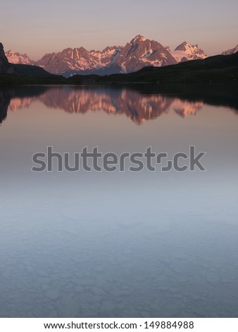 Mountain range reflection in a lake at sunrise