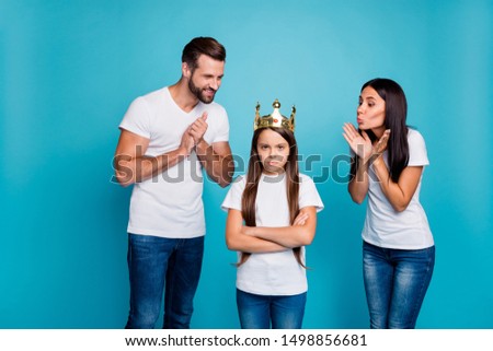 Daddy mommy proud of small lady wearing diadem hate being princess isolated blue background