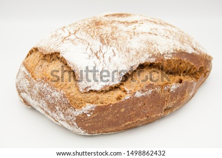 malt ciabatta, rural homemade bread, breakfast bread, on a white plate, close-up