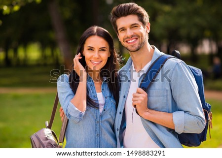 Photo of amazing two groupmates walking dormitory hostel after lessons making portraits wear denim outfit