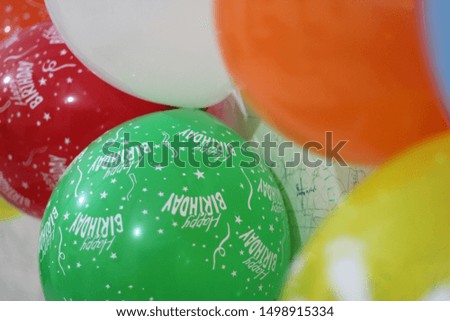 Happy Birthday balloons and party confetti