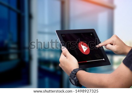 video marketing concept.Hands holding tablet Royalty-Free Stock Photo #1498927325