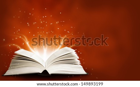 Opened magic book with magic light. Education