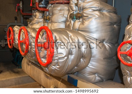 Industrial central heating system with insulation to maintain a high efficient warmth distribution system Royalty-Free Stock Photo #1498995692