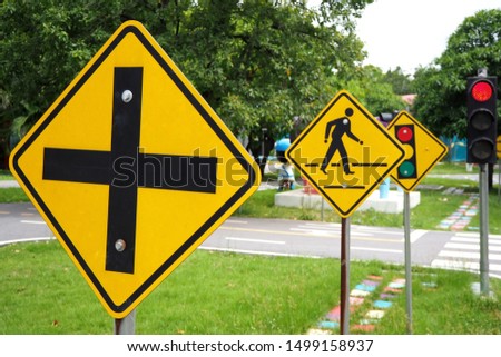Traffic signs, intersections, be careful of people crossing the road and traffic lights.