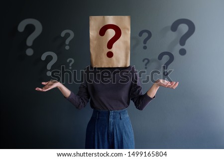 Marketing Strategy and Business Relationship Concept. Know Your Customer. Young Client on Covered Bag with Many Question Marks Royalty-Free Stock Photo #1499165804