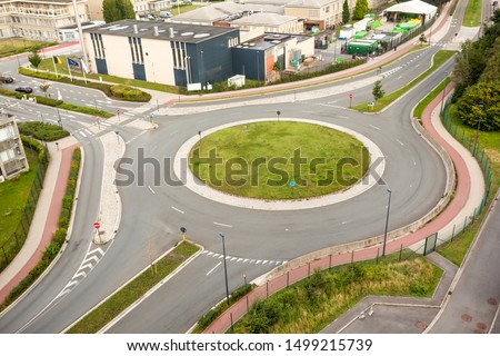 a roundabout, also called a traffic circle, road circle, rotary
