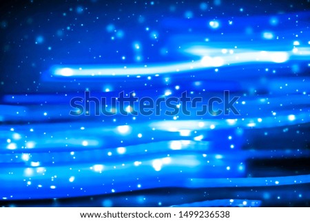 Christmas lights, New Years Eve card and cosmic texture concept - Winter holiday abstract background, glowing snow and magic sparkling shiny glitter