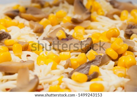 Close up picture of delicious pizza with mushroom and corn topping