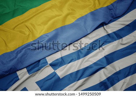 waving colorful flag of greece and national flag of gabon. macro