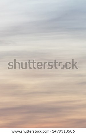 Vertical ratio size of sunset background. sky with soft and blur pastel colored clouds. gradient cloud on the beach resort. nature. sunrise.  peaceful morning.  