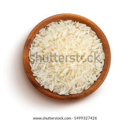 Basmati rice groats in a wooden bowl isolated on white background with clipping path, top view Royalty-Free Stock Photo #1499327426