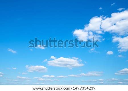 little light cumuli clouds in blue sky on sunny august day Royalty-Free Stock Photo #1499334239