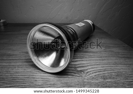 old flash light in black and white