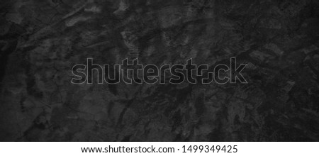 Dark cracked concrete background. Dark black cracked concrete or cement texture surface