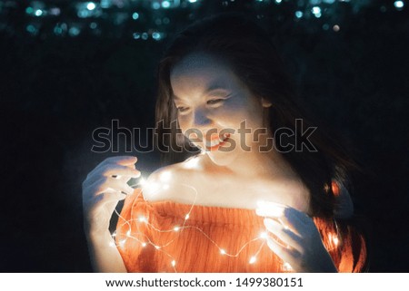 Beautiful Asian woman happy with fairly light fancy outdoor on city night picture style