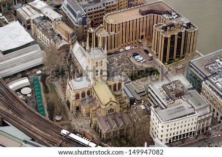 The historic Southwark Cathedral beside the banks of the River Thames in Central London.  Viewed from a tall building.