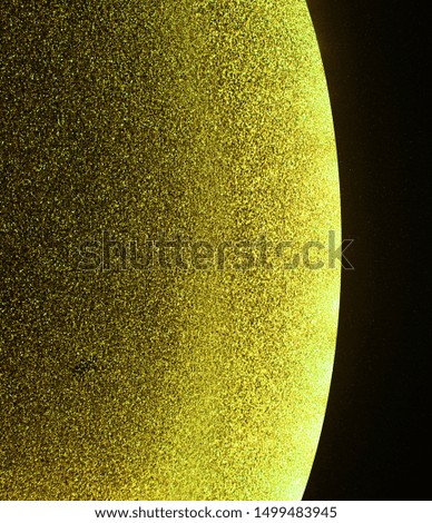 Texture of yellow sparkling paper. Photo made in cosmos style.