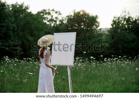 woman, in a straw hat, artist, paints, in a white sarofan, draws, in nature, brushes, young lady