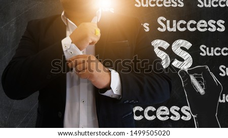 businessman and chalk board in Strategy and successful concept , man and success drawing on black board design with Warm light in Business idea and copy space for text.