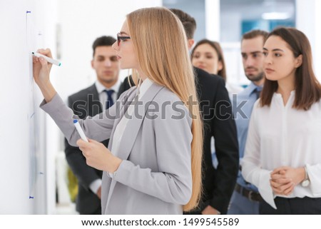 Group of people with business trainer at management seminar Royalty-Free Stock Photo #1499545589