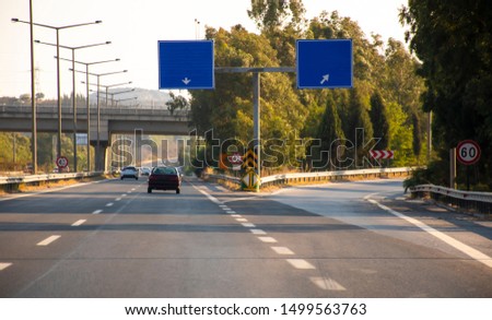 Road signs on the highway. Road junction to the right