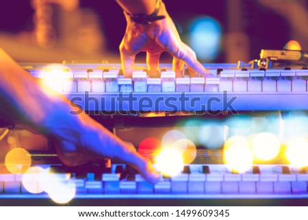 Live music and music festival background.Instrument on stage and band.Stage lights.Abstract musical background.Playing piano and concert concept.