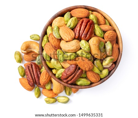 unsalted mixed nuts in the wooden bowl, isolated on white background, top view Royalty-Free Stock Photo #1499635331