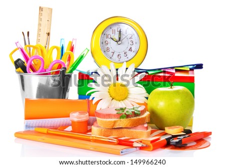 Big a set of school accessories, hours sandwich and the apple isolated on white