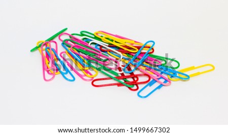 Colorful paper clips abstract isolated on white