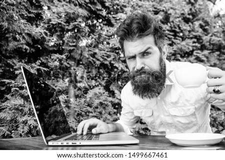Remote job. Freelance professional occupation. Caffeine booster for productivity. Online blog. Blogger freelance editor. Workaholic stereotype. Drink coffee work faster. Bearded man freelance worker.