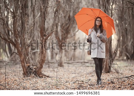 girl umbrella forest landscape / autumn view young woman with umbrella in city park