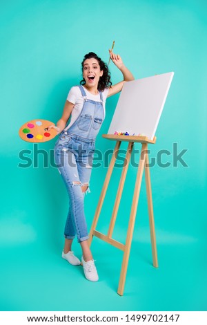 Vertical full length body size view of her she nice attractive cheerful cheery wavy-haired girl wearing casual drawing collage water color isolated on bright vivid shine green turquoise background