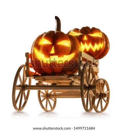 Halloween pumpkins in farm wagon isolated on white background.
