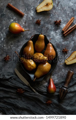 Honey poured baked pears in a plate Dark photo