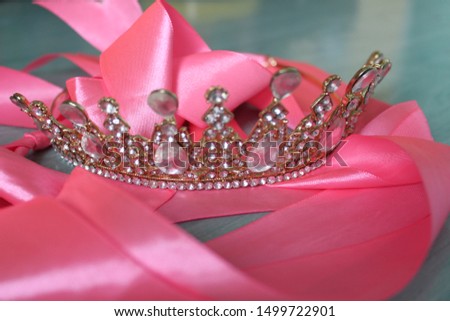 beautiful crown on a pink ribbon