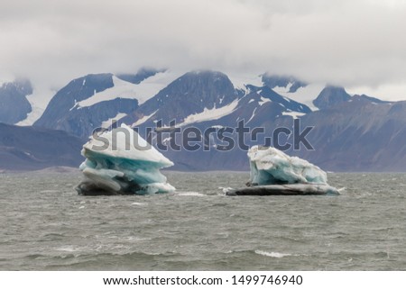 Glacier landscape of Spitsbergen, blue ice sea mountains 